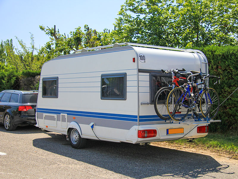 A car towing a caravan on a holiday trip