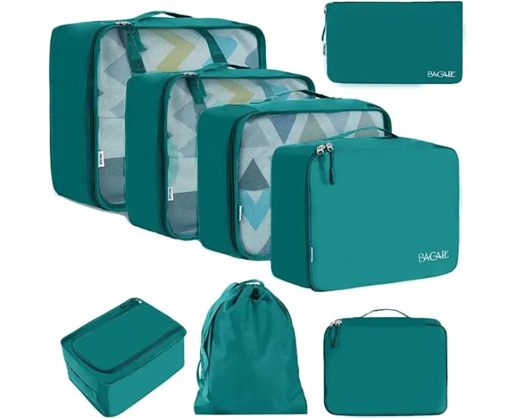 A set of packing cubes in a deep teal colour