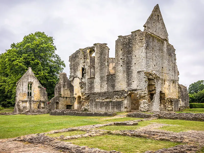 The ruins of Minster Lovell Hall on the River Windrush in the Cotswolds, England.