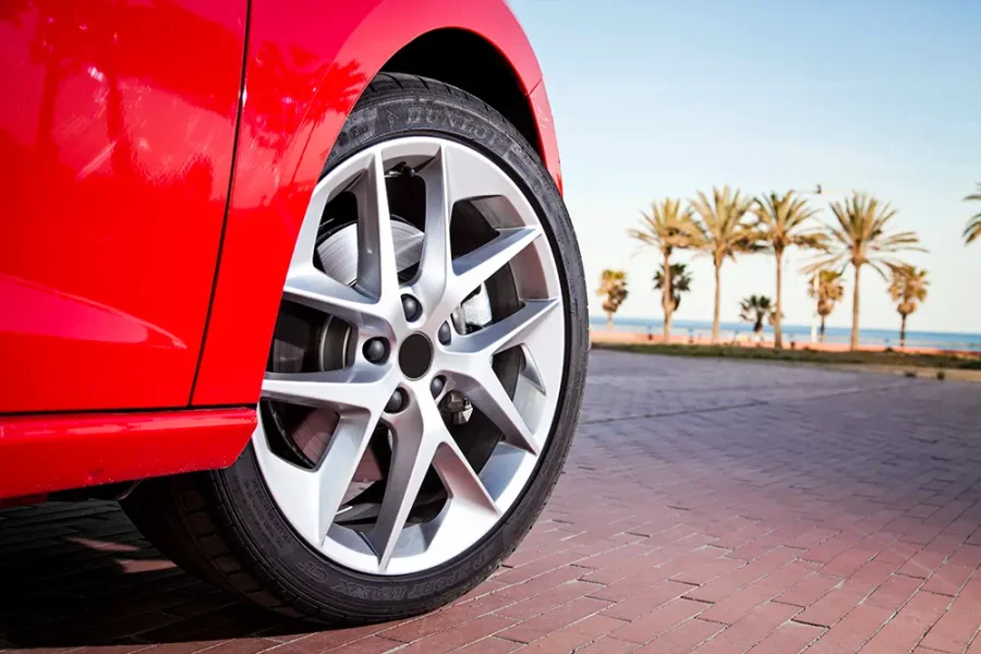 Alloy wheels on a red car.