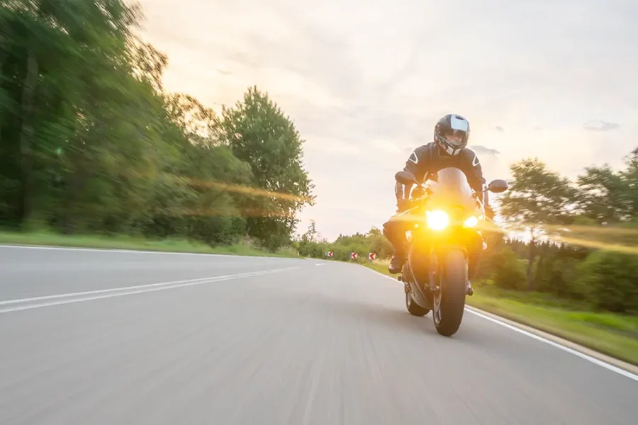 A motorcyclist riding along the open road.